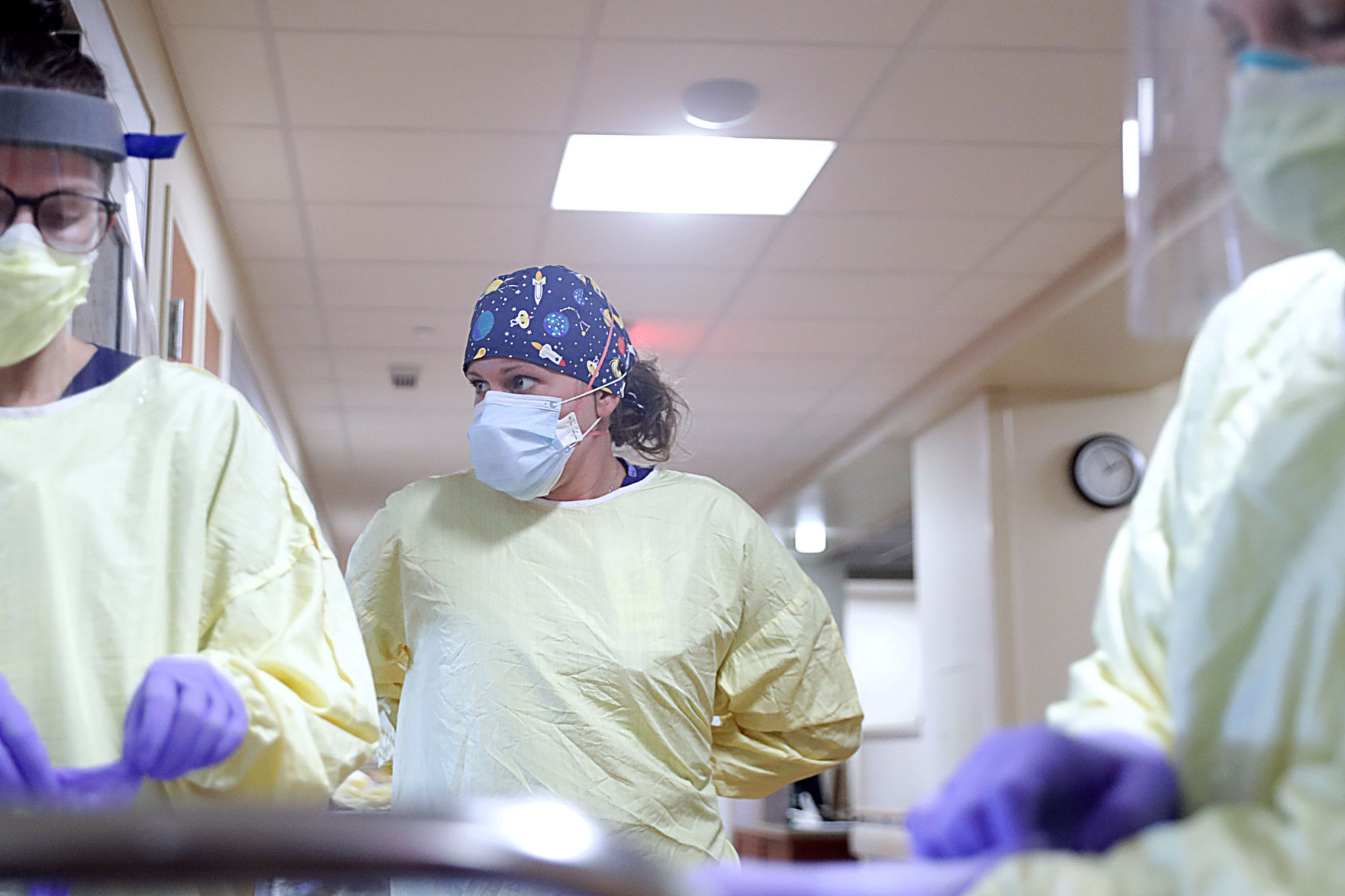 Finch putting on gown